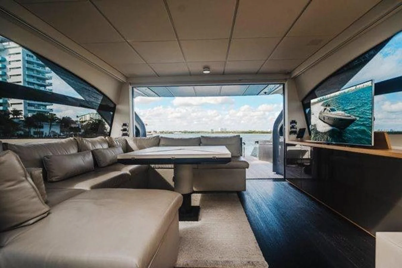 a room with couches and a table aboard CLAIMS TO FAME Yacht for Sale