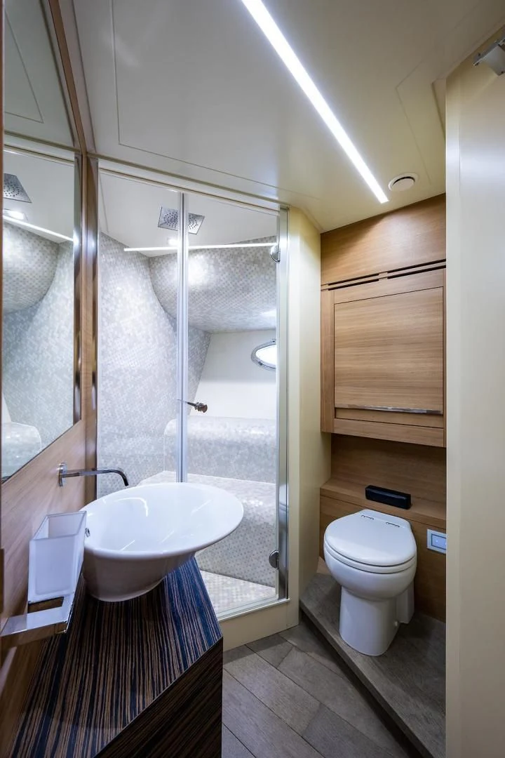 a bathroom with a shower and toilet aboard CLAIMS TO FAME Yacht for Sale
