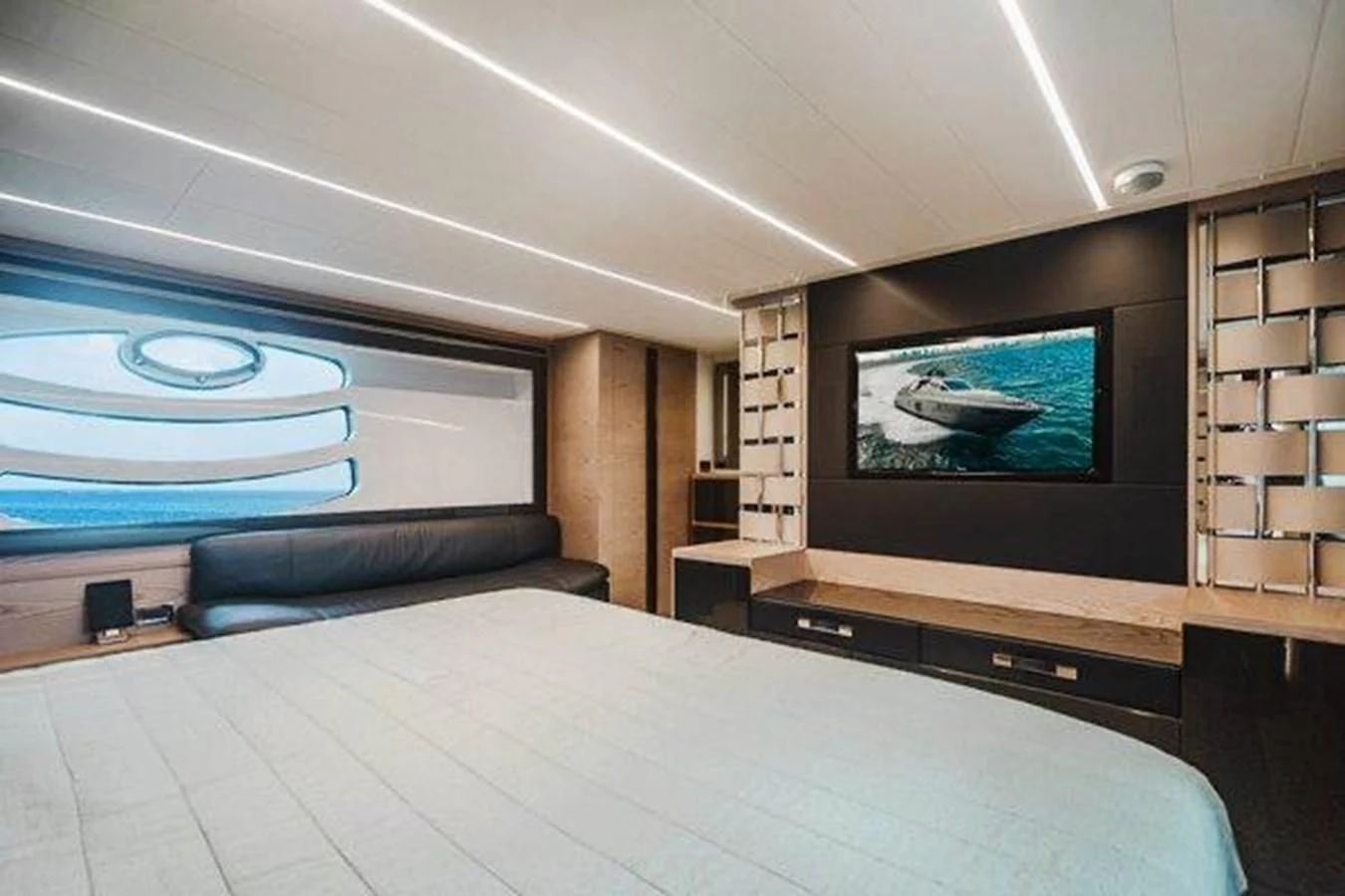 a room with a large television and a bed aboard CLAIMS TO FAME Yacht for Sale