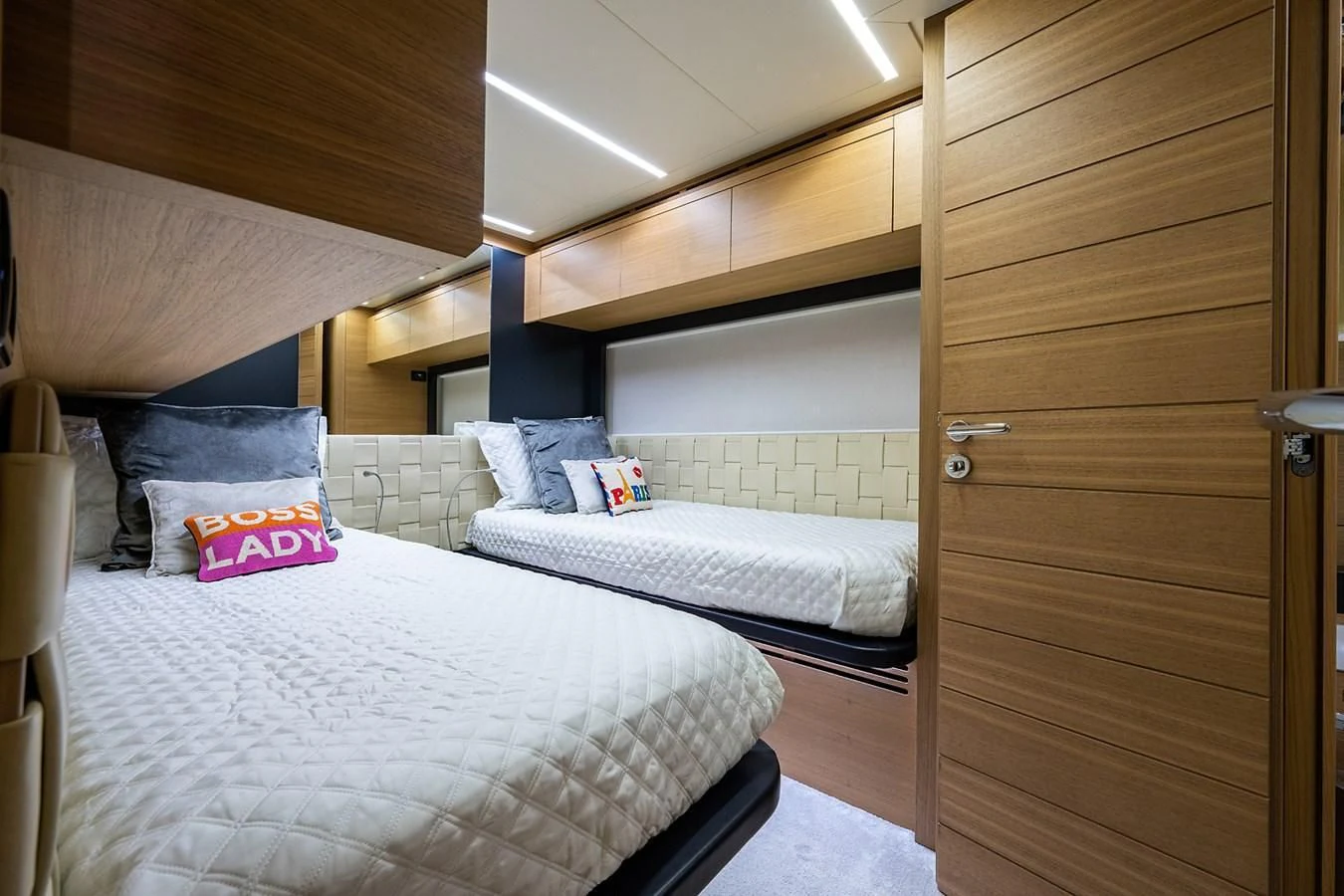 a room with two beds aboard CLAIMS TO FAME Yacht for Sale