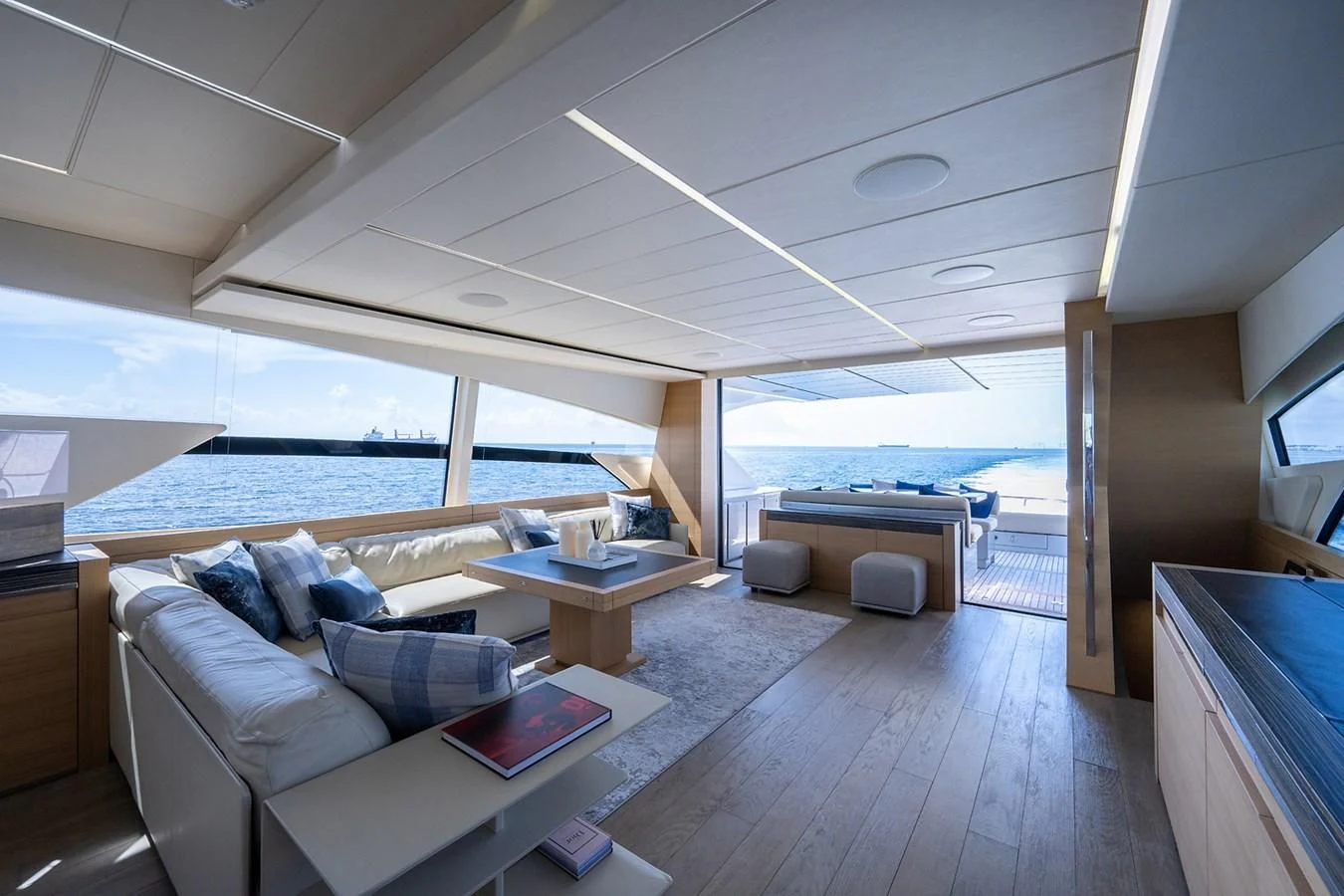 a living room with a large window aboard CLAIMS TO FAME Yacht for Sale