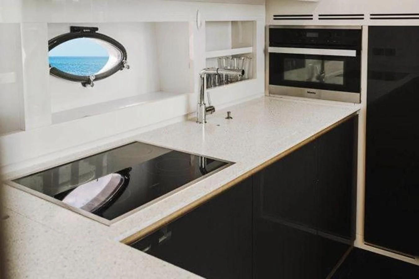 a kitchen with a sink and a mirror aboard CLAIMS TO FAME Yacht for Sale