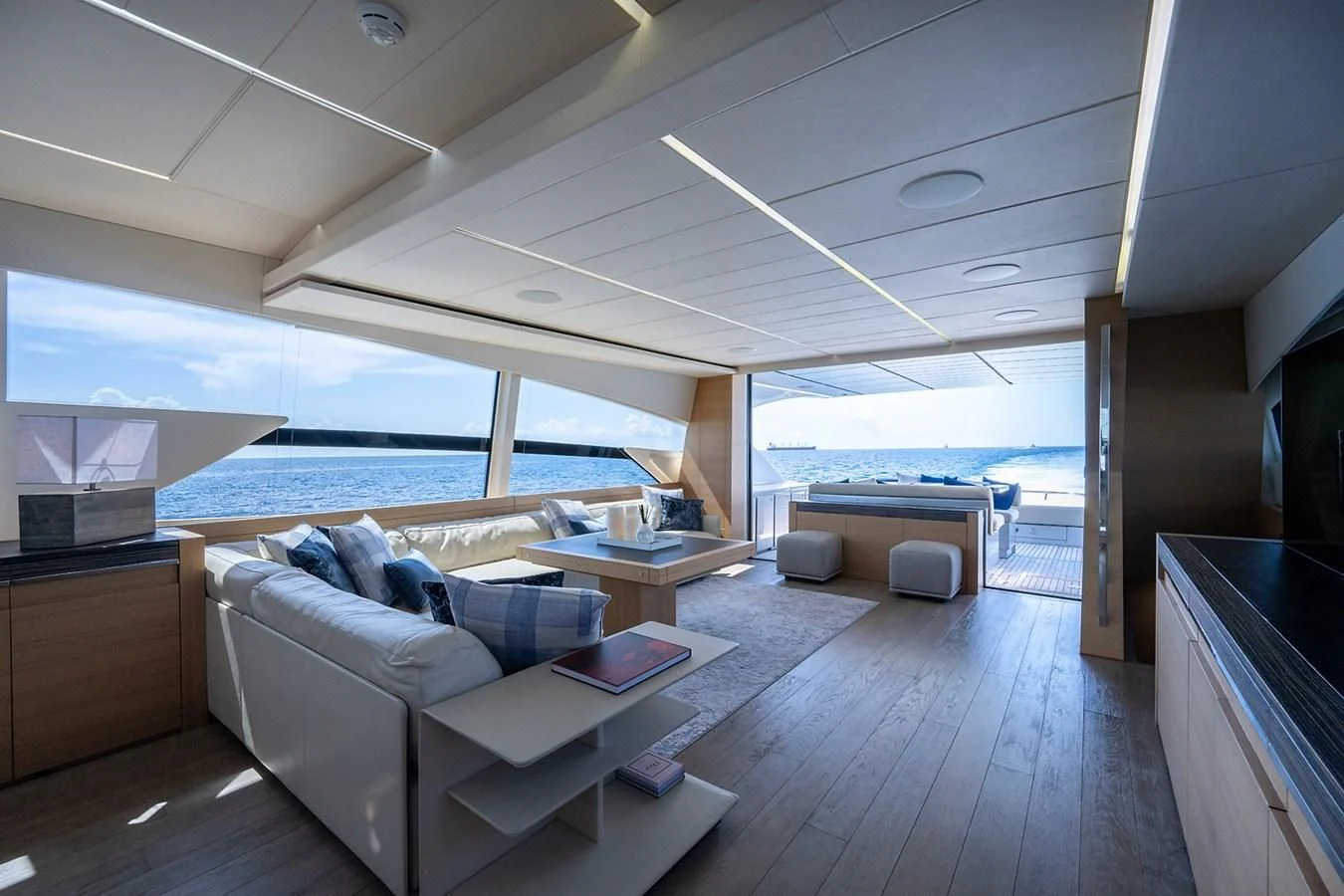 a living room with a large window aboard CLAIMS TO FAME Yacht for Sale