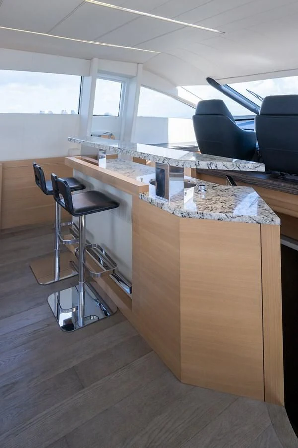 a room with a desk and chairs aboard CLAIMS TO FAME Yacht for Sale