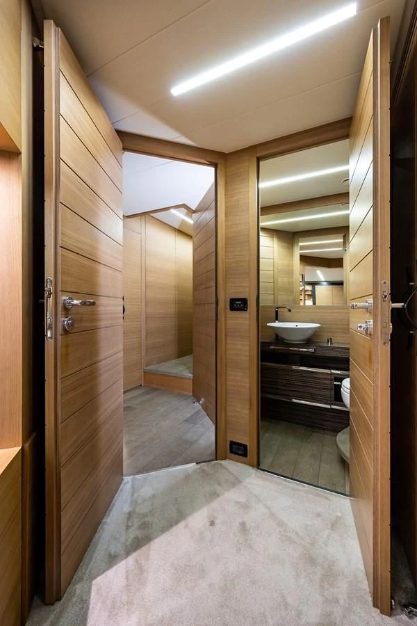 a bathroom with a sink and a mirror aboard CLAIMS TO FAME Yacht for Sale