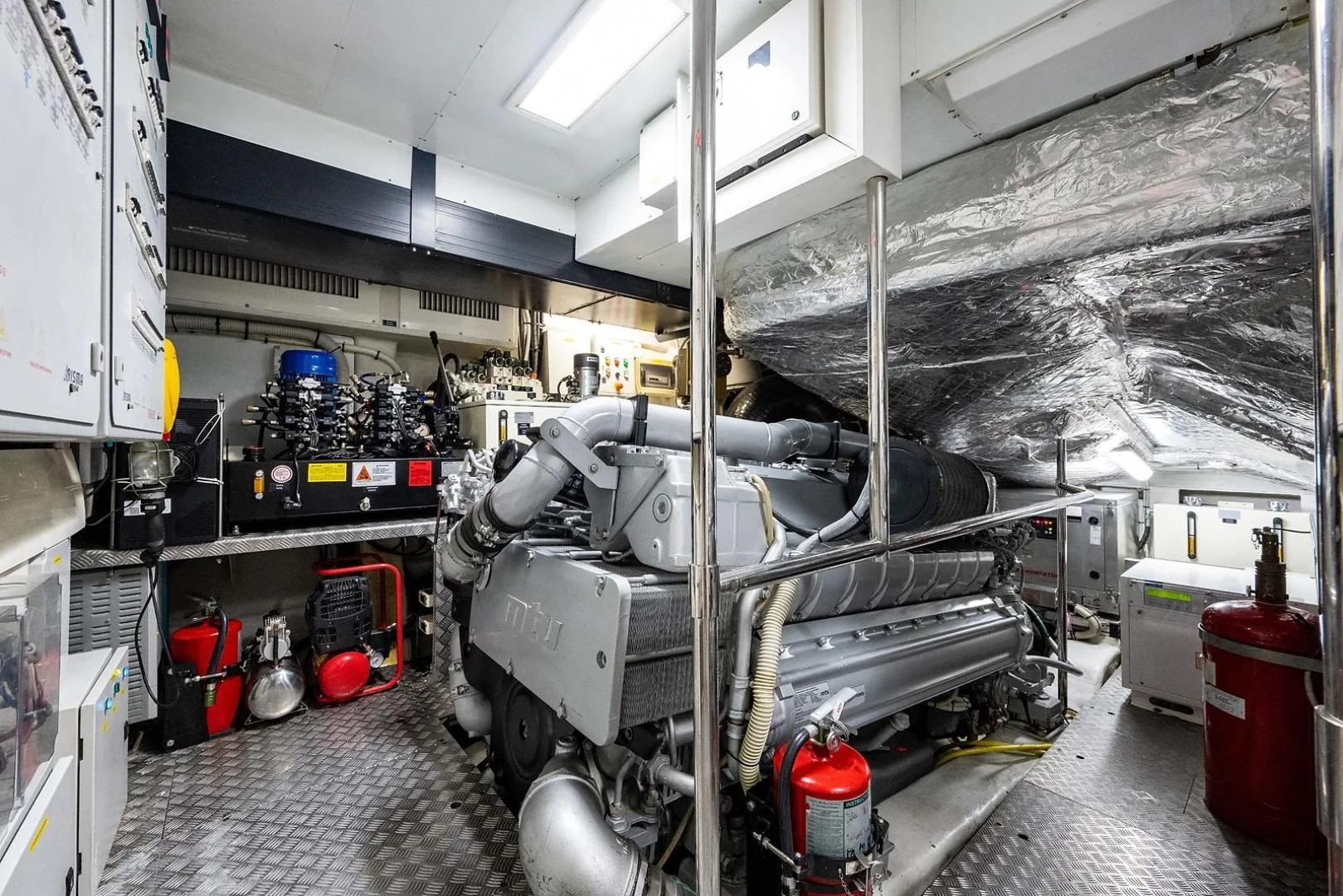a room with machinery and pipes aboard CLAIMS TO FAME Yacht for Sale