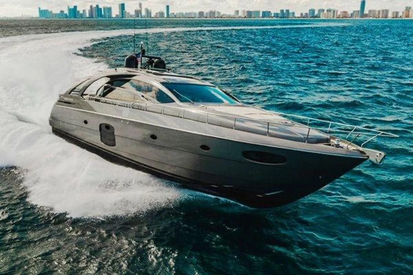 a white yacht on the water aboard CLAIMS TO FAME Yacht for Sale