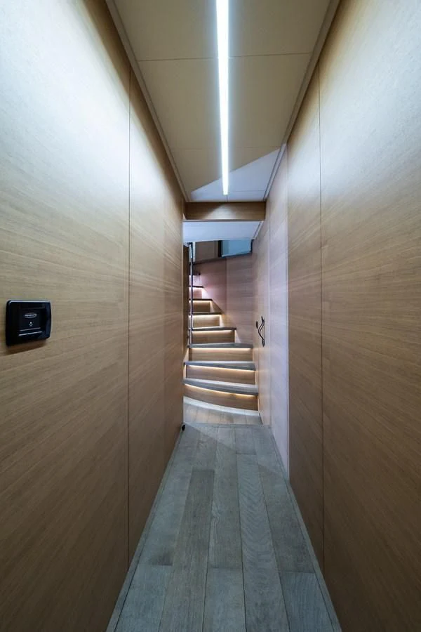a long hallway with a light aboard CLAIMS TO FAME Yacht for Sale