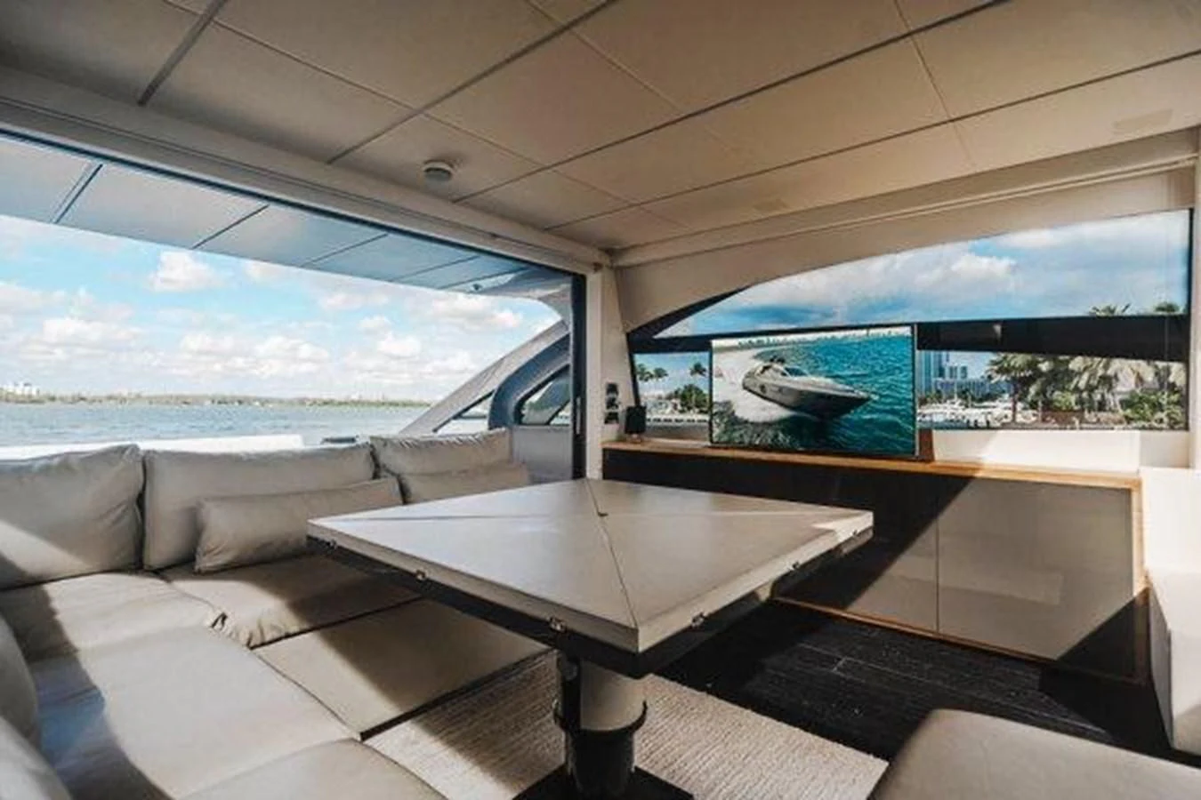 a room with a couch and a table aboard CLAIMS TO FAME Yacht for Sale