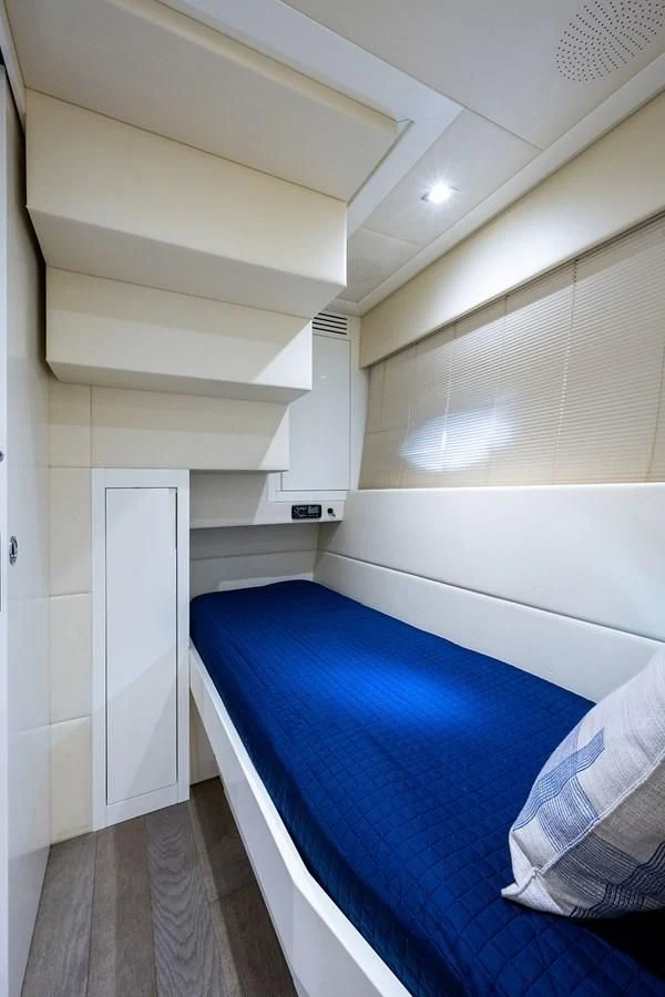 a room with a bed and a door aboard CLAIMS TO FAME Yacht for Sale