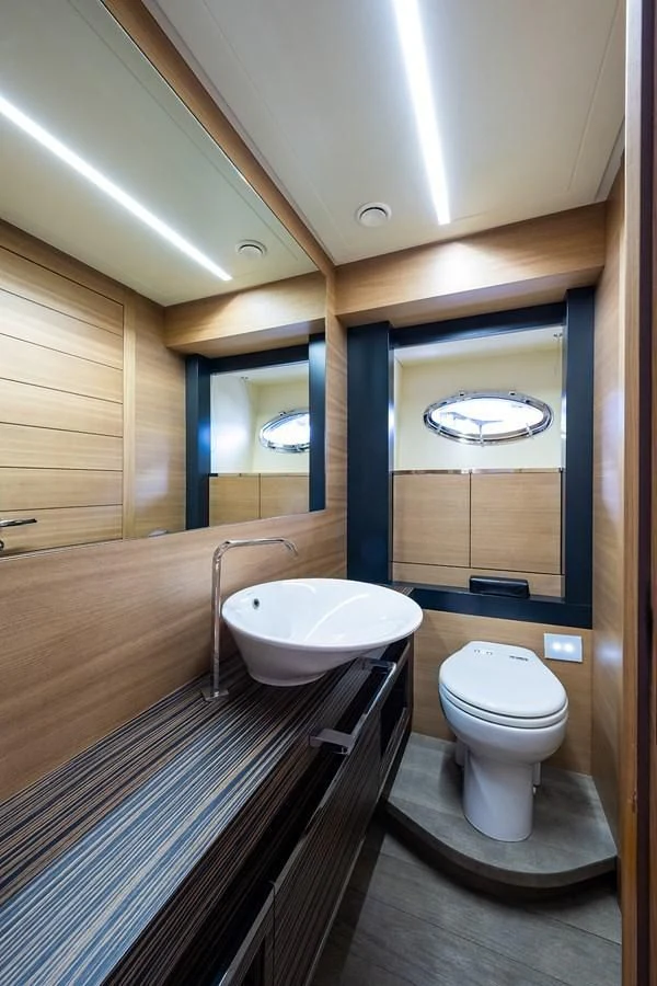 a bathroom with a sink toilet and bathtub aboard CLAIMS TO FAME Yacht for Sale