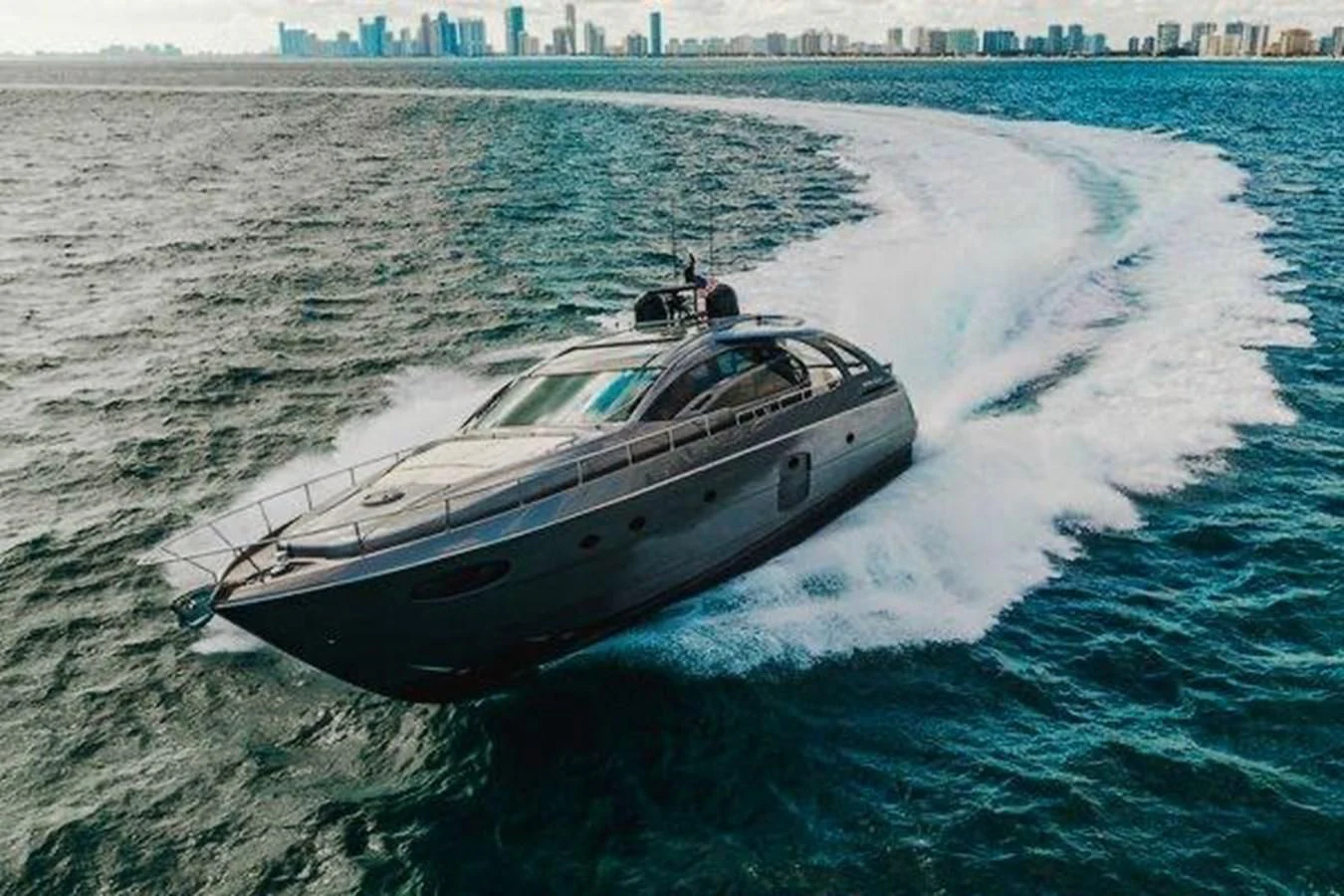 a helicopter flying over a boat aboard CLAIMS TO FAME Yacht for Sale