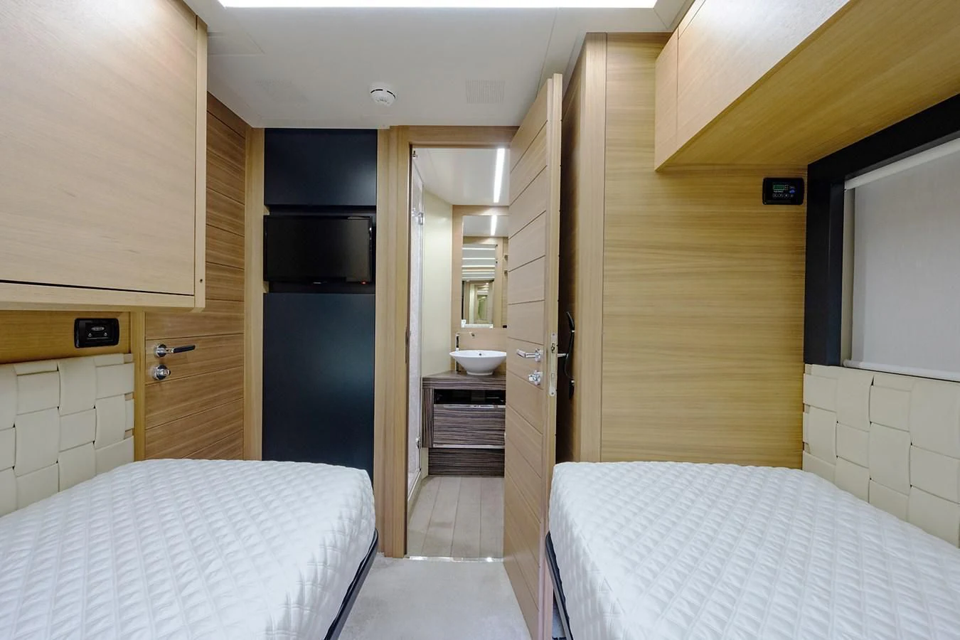 a room with a bed and a microwave aboard CLAIMS TO FAME Yacht for Sale
