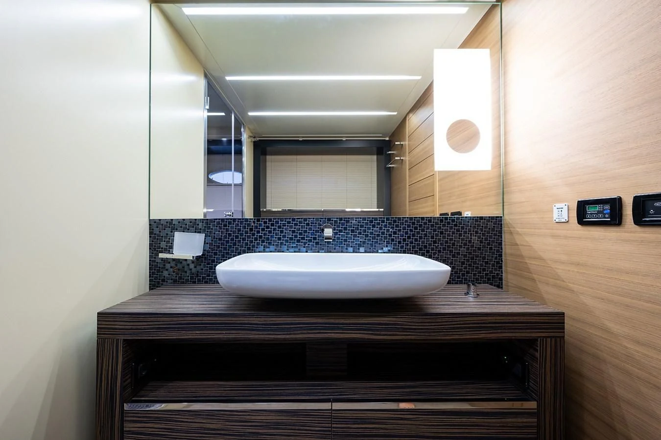 a bathroom with a large mirror aboard CLAIMS TO FAME Yacht for Sale