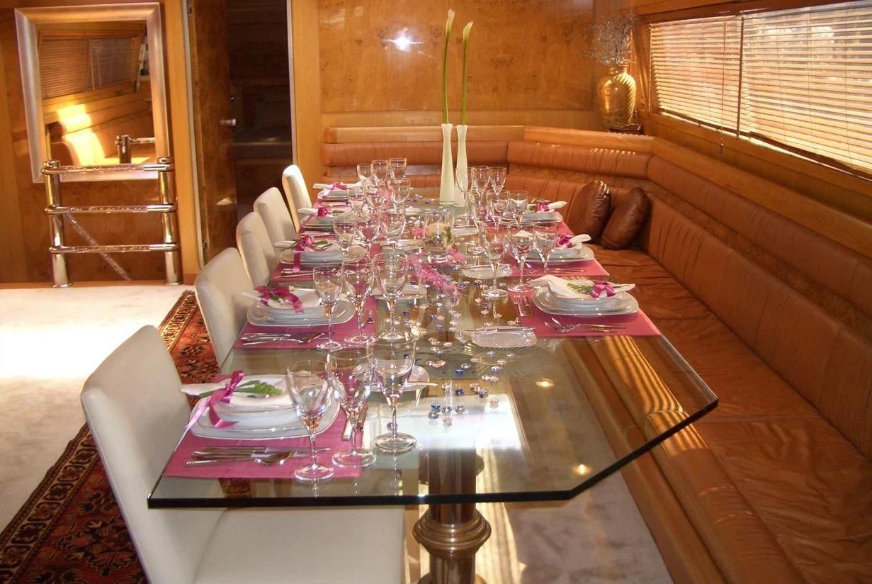 a table set with plates and glasses aboard SUHEYLA SULTAN Yacht for Sale