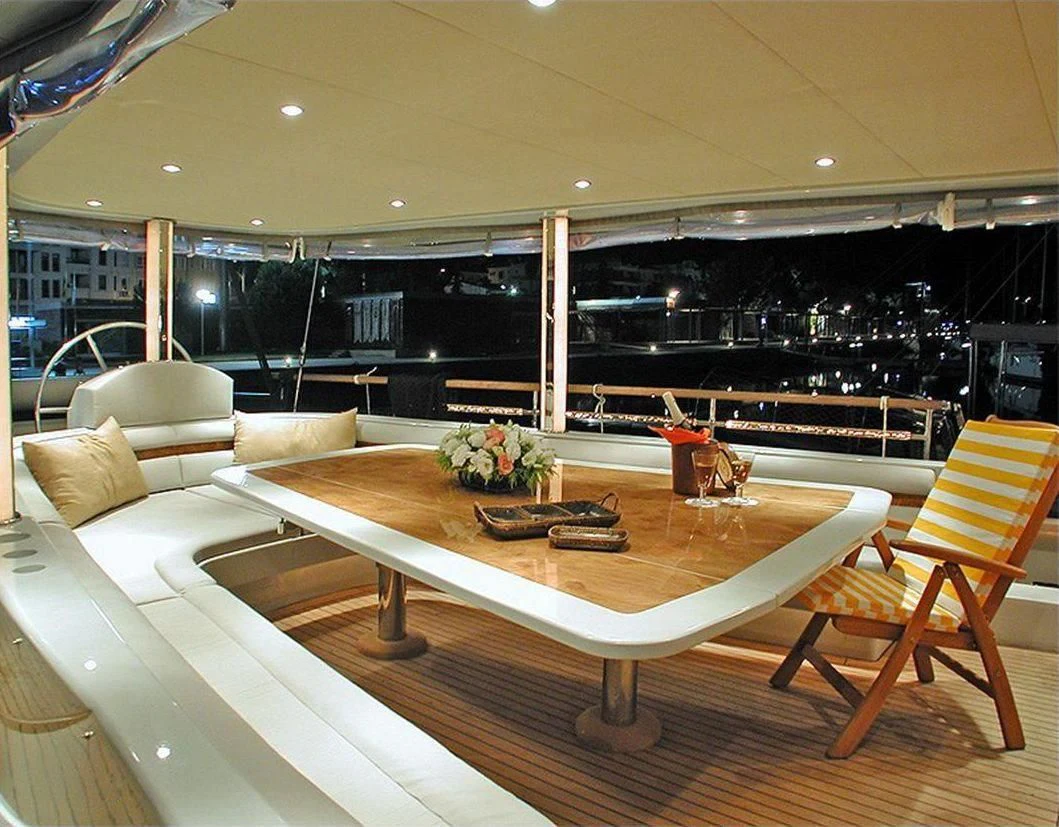 a room with a table and chairs aboard SUHEYLA SULTAN Yacht for Sale