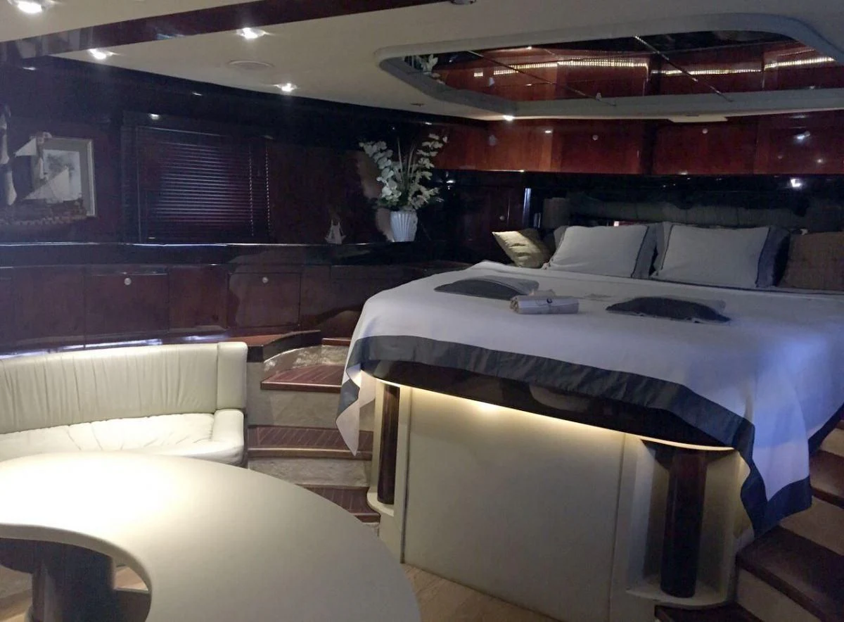 a room with a bed and a couch aboard SUHEYLA SULTAN Yacht for Sale