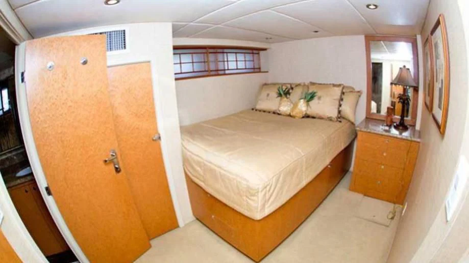 a bedroom with a bed and a closet aboard SHERAZADE Yacht for Sale