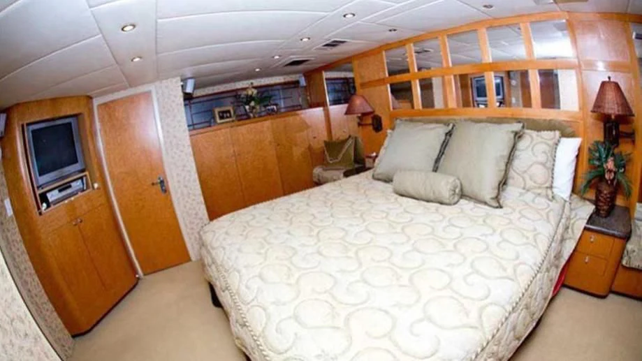 a large bed in a room aboard SHERAZADE Yacht for Sale