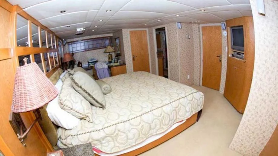 a person sitting on a bed aboard SHERAZADE Yacht for Sale