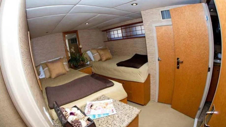a room with a bed and a couch aboard SHERAZADE Yacht for Sale