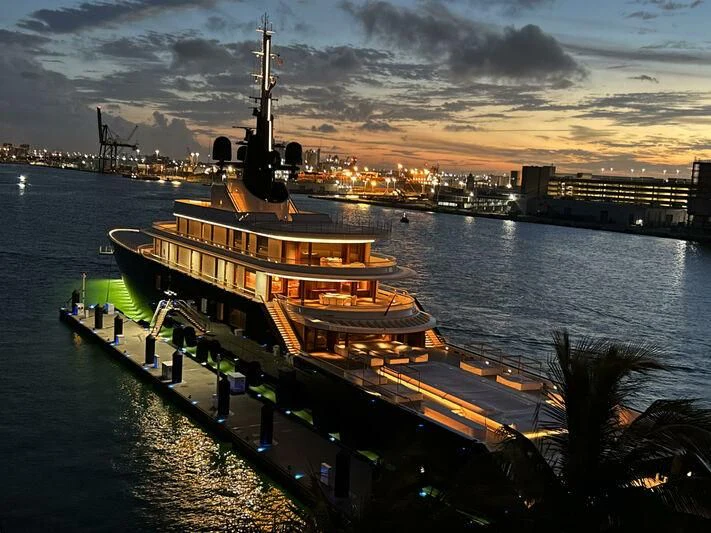 a large building with a tower by a body of water aboard LIVA Yacht for Sale