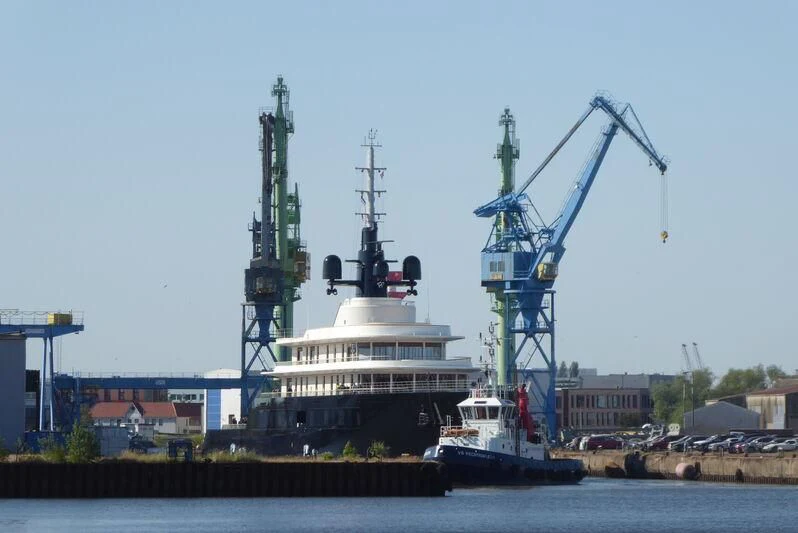 a large boat in a harbor aboard LIVA Yacht for Sale