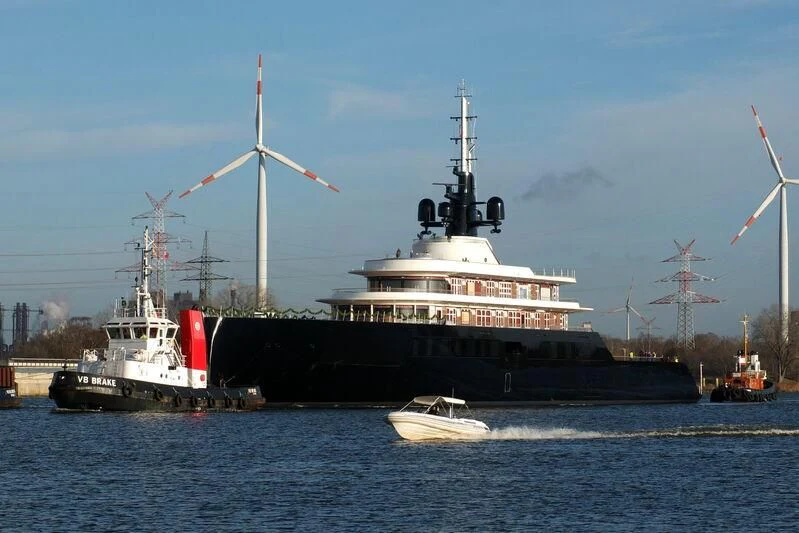 a large boat with a crane on the side of it aboard LIVA Yacht for Sale