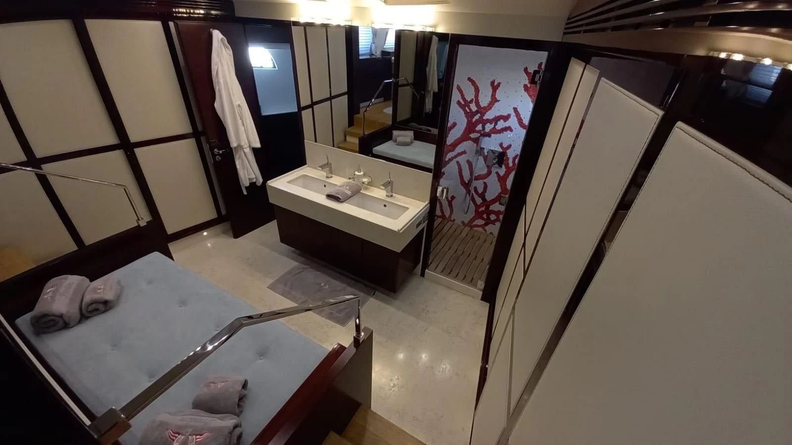 a bathroom with a large mirror aboard FREEDOM Yacht for Sale