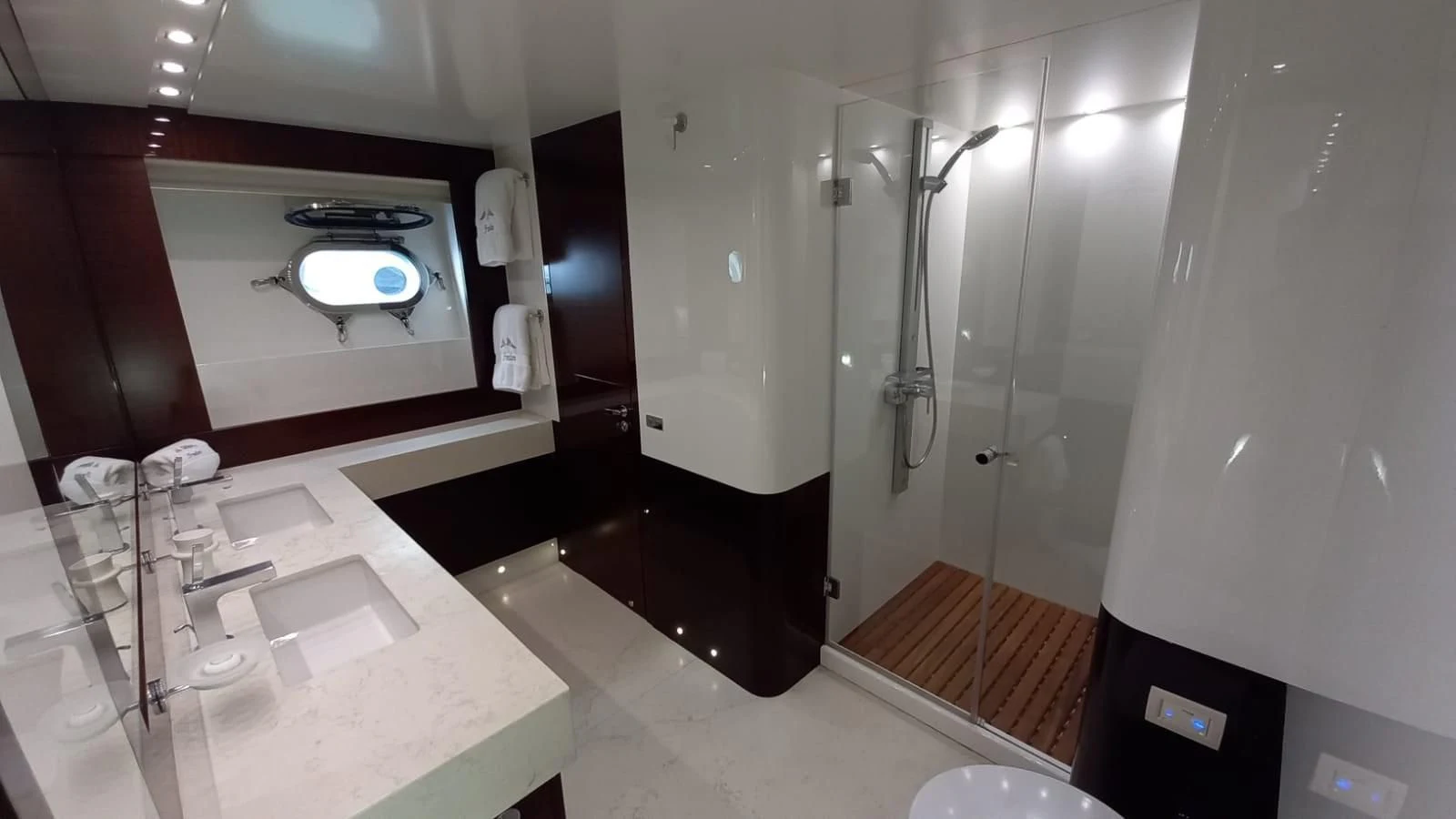 a bathroom with a large mirror aboard FREEDOM Yacht for Sale