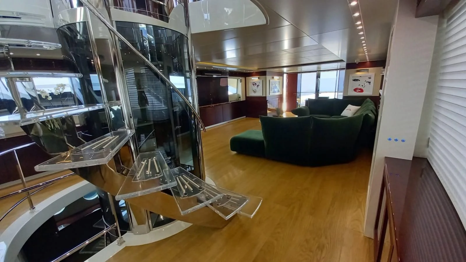 a room with a couch and a table aboard FREEDOM Yacht for Sale