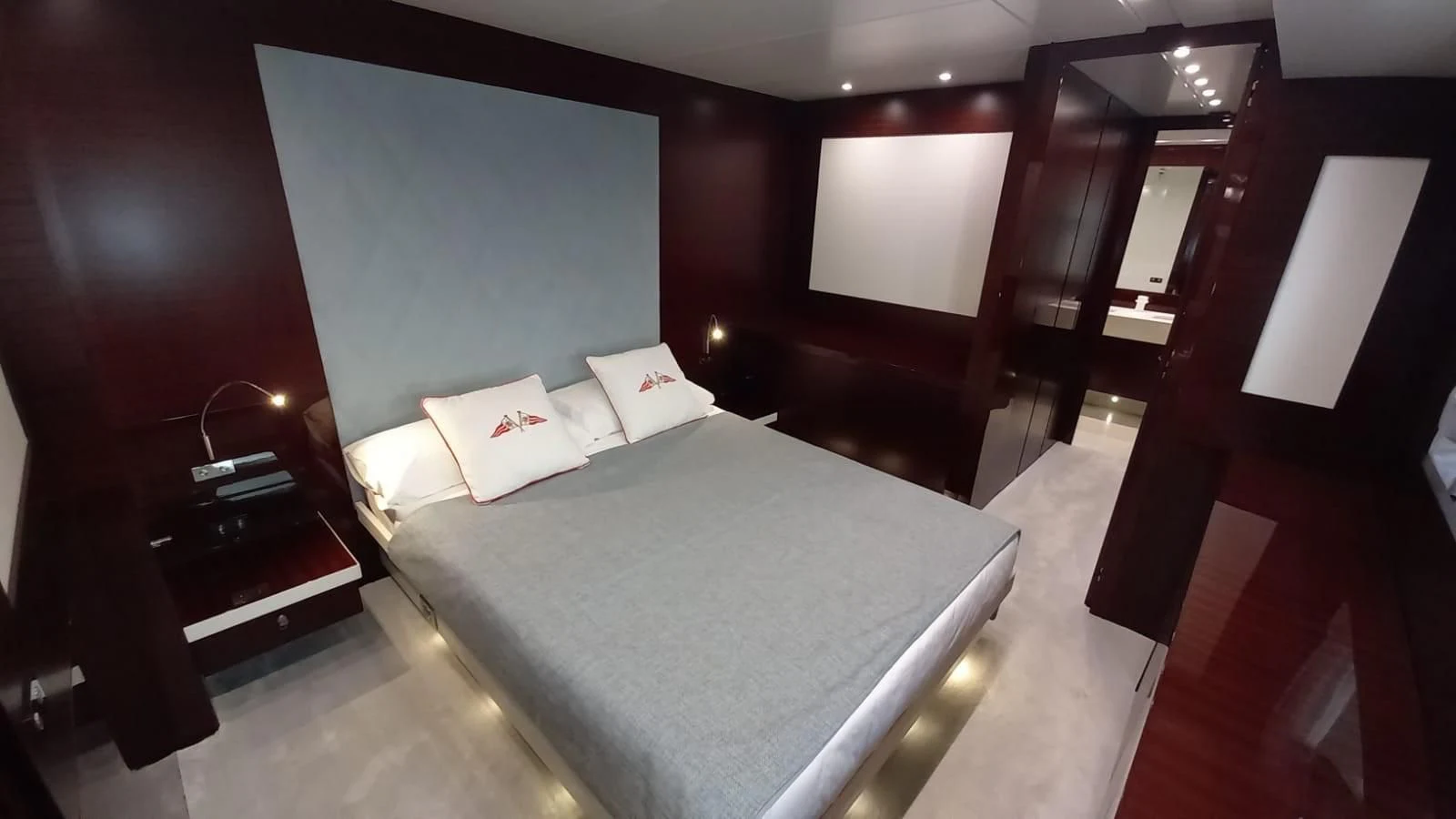 a bed in a room aboard FREEDOM Yacht for Sale