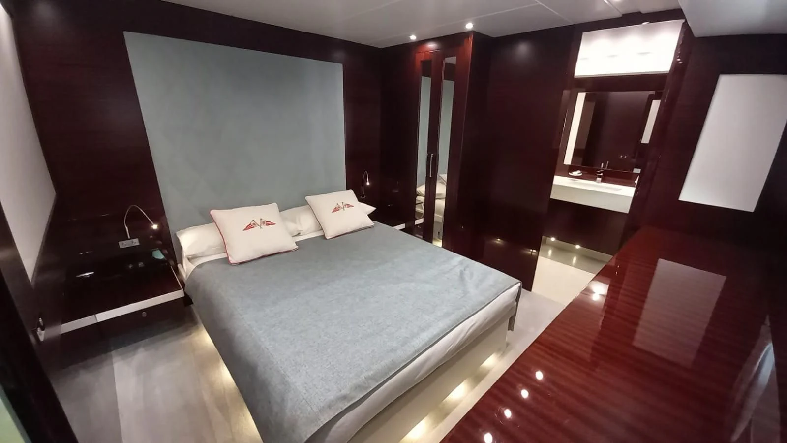 a bed in a room aboard FREEDOM Yacht for Sale