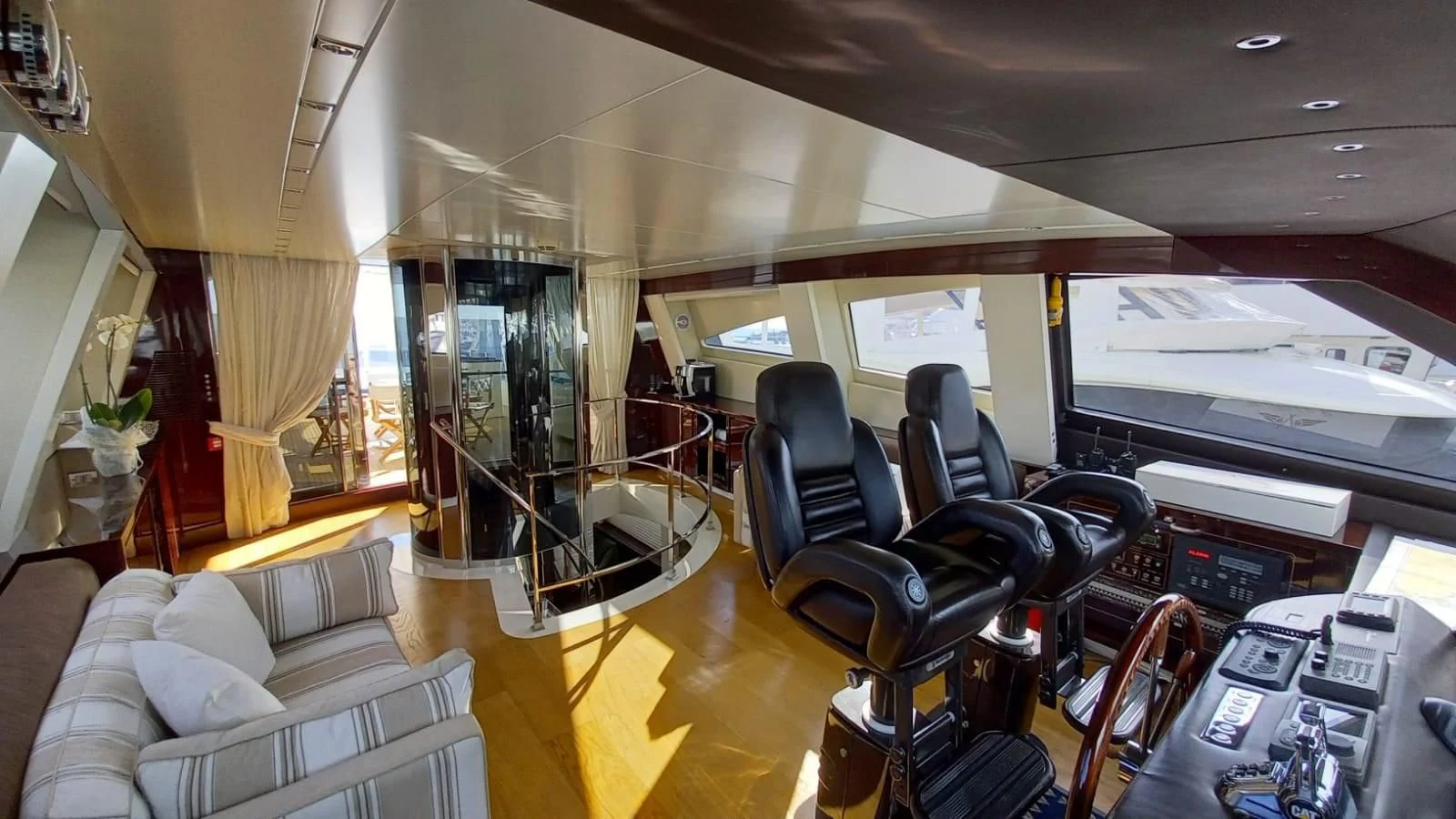 a room with a couch and a television aboard FREEDOM Yacht for Sale
