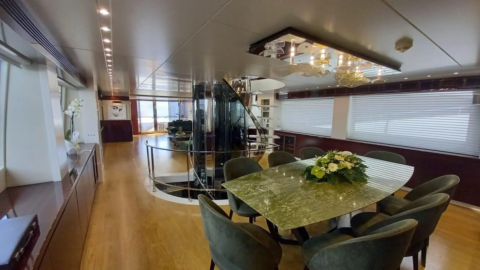 a dining room with a table and chairs aboard FREEDOM Yacht for Sale