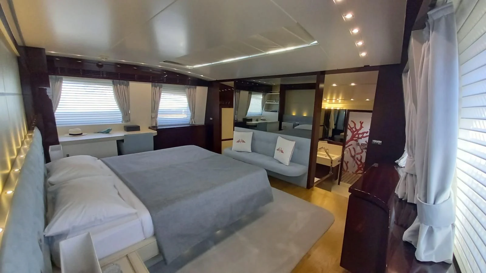 a room with a bed and a couch aboard FREEDOM Yacht for Sale