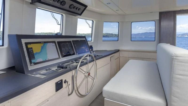 a room with a couch and a television aboard T9 Yacht for Sale
