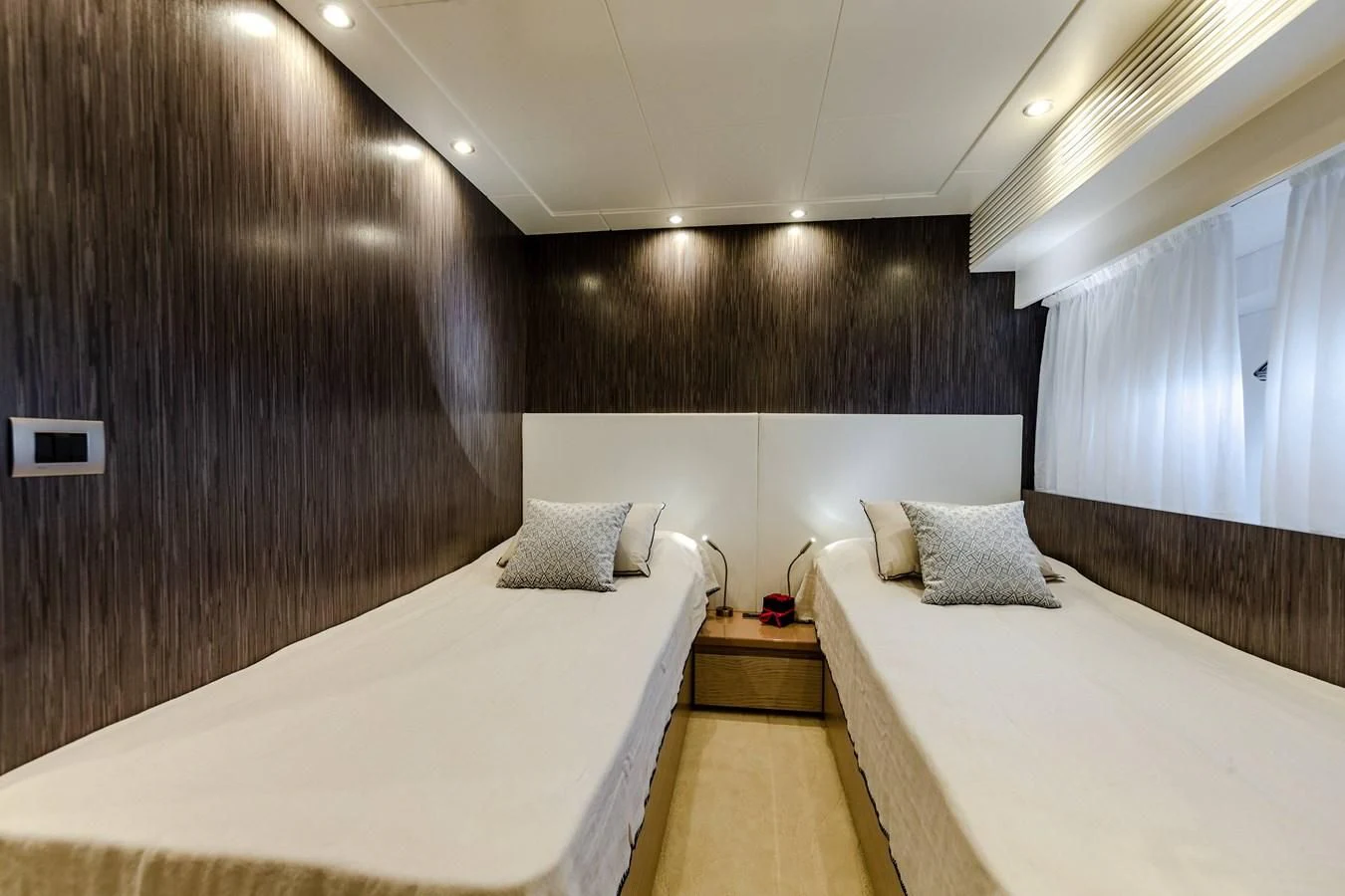 a room with two beds aboard T9 Yacht for Sale