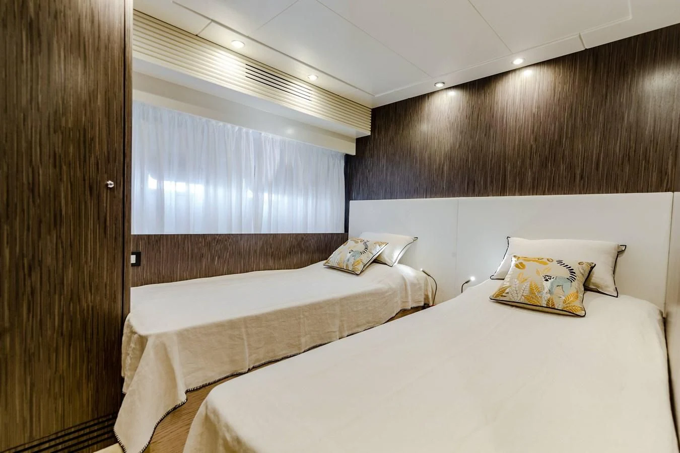 a room with two beds aboard T9 Yacht for Sale
