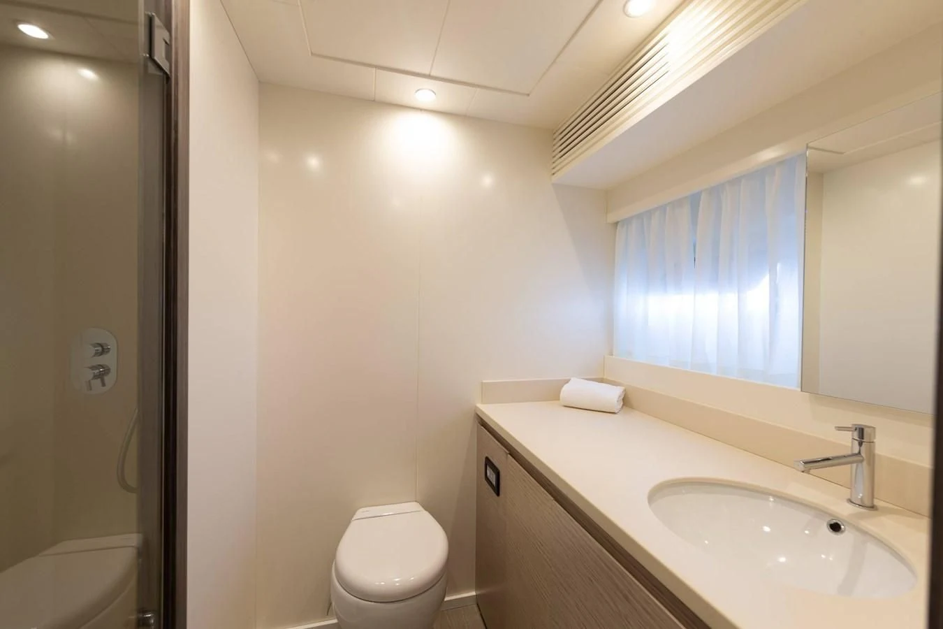 a bathroom with a toilet and sink aboard T9 Yacht for Sale