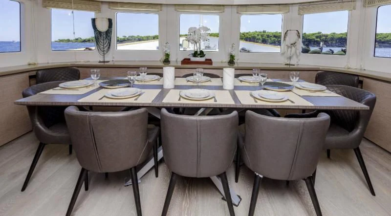 a dining table set for a meal aboard T9 Yacht for Sale