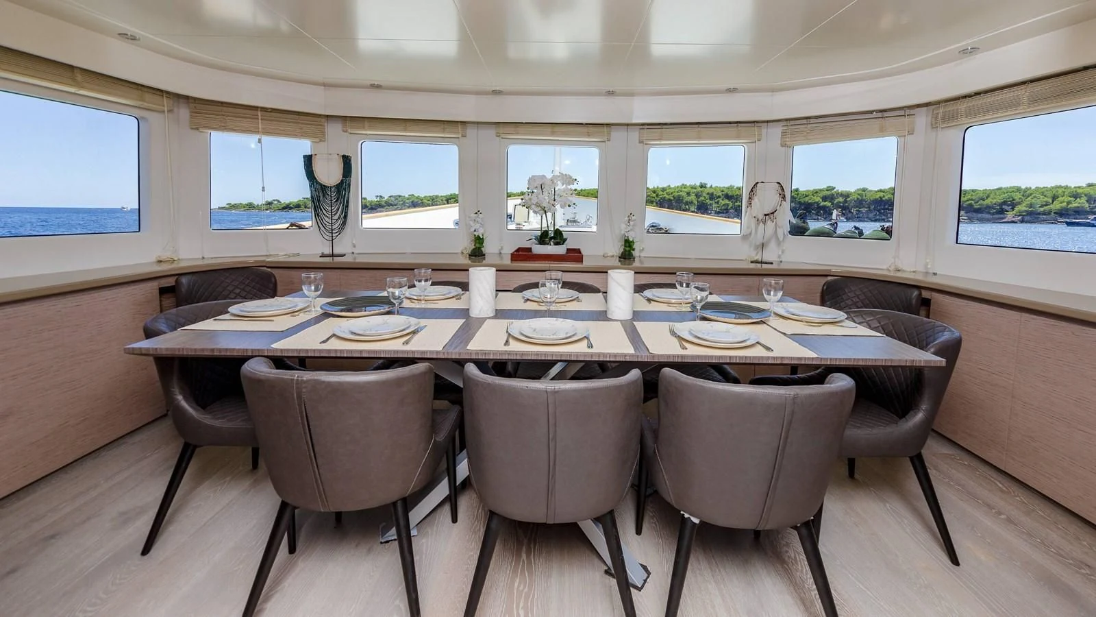 a dining table with chairs aboard T9 Yacht for Sale
