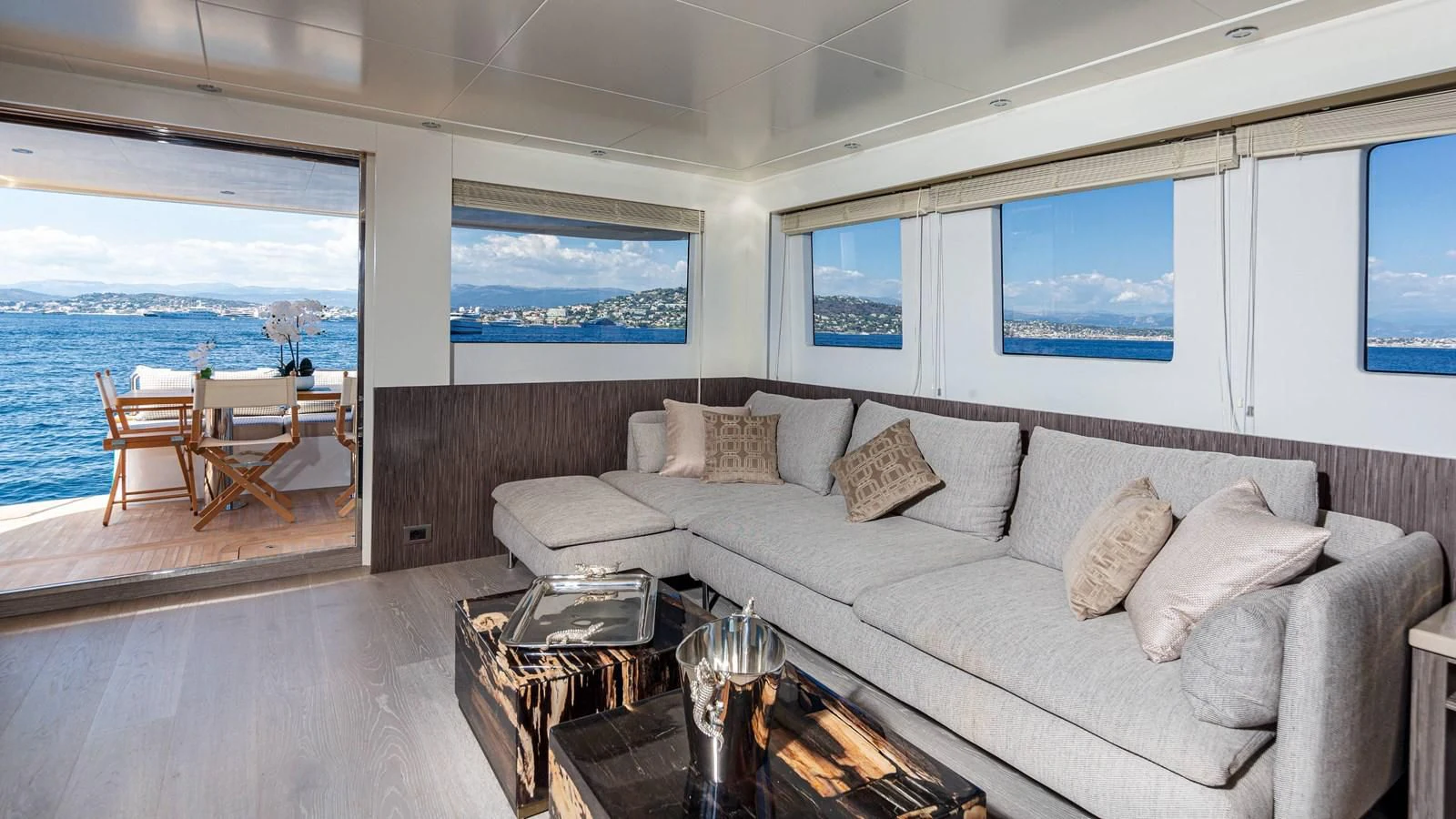 a living room with a couch and a table aboard T9 Yacht for Sale