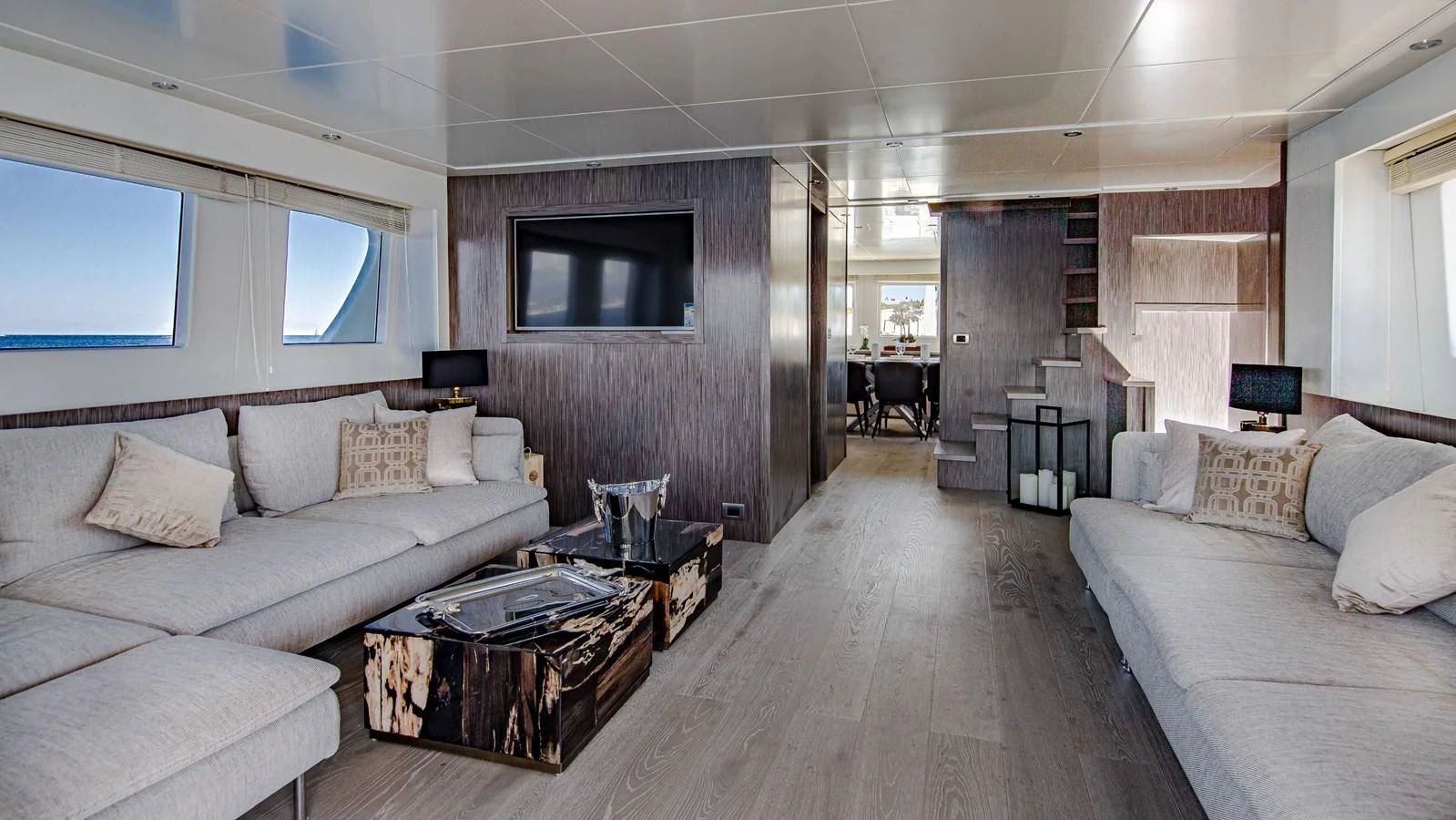 a living room with a couch and a television aboard T9 Yacht for Sale