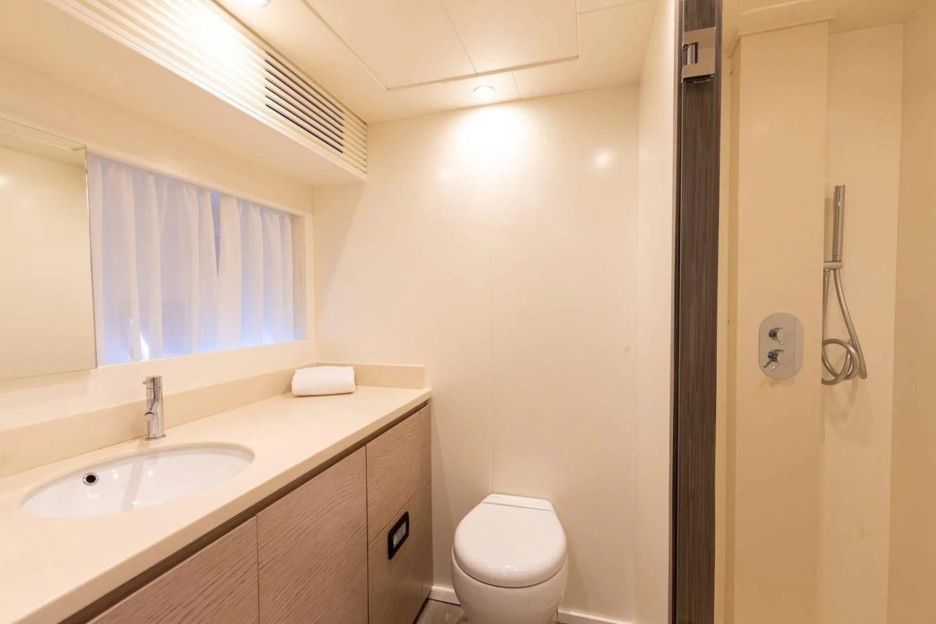 a bathroom with a sink and a toilet aboard T9 Yacht for Sale