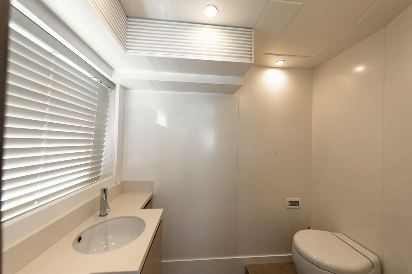 a bathroom with a sink and a toilet aboard T9 Yacht for Sale