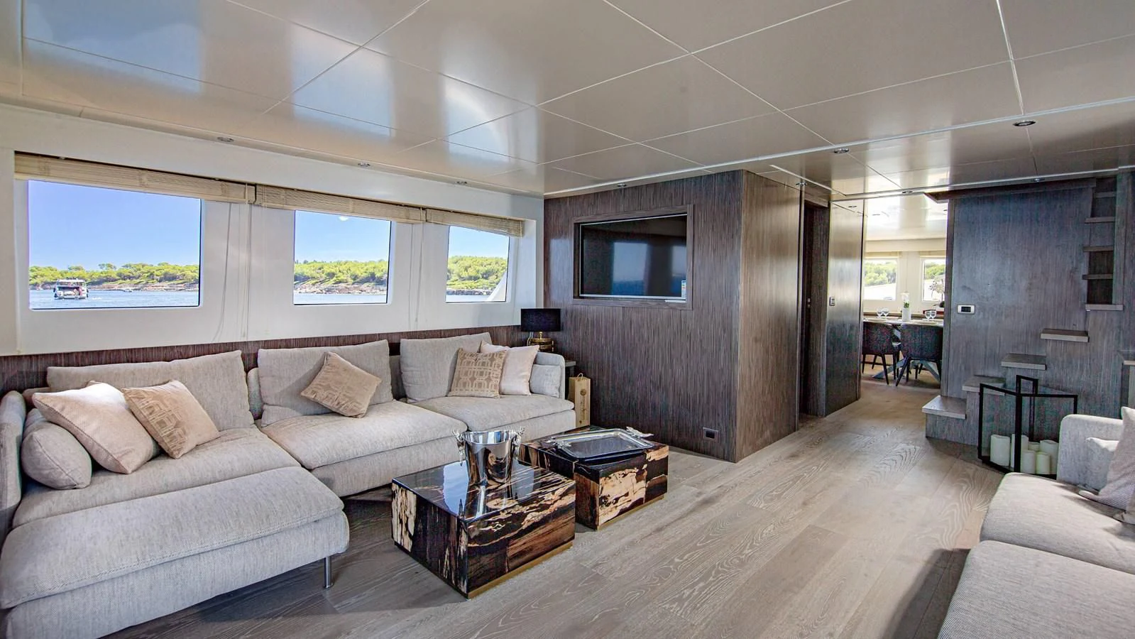 a living room with a couch and a tv aboard T9 Yacht for Sale