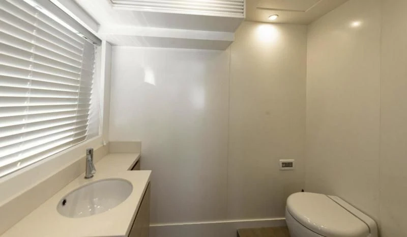 a bathroom with a sink and a toilet aboard T9 Yacht for Sale