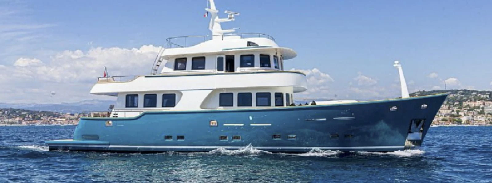 a large white boat in the water aboard T9 Yacht for Sale