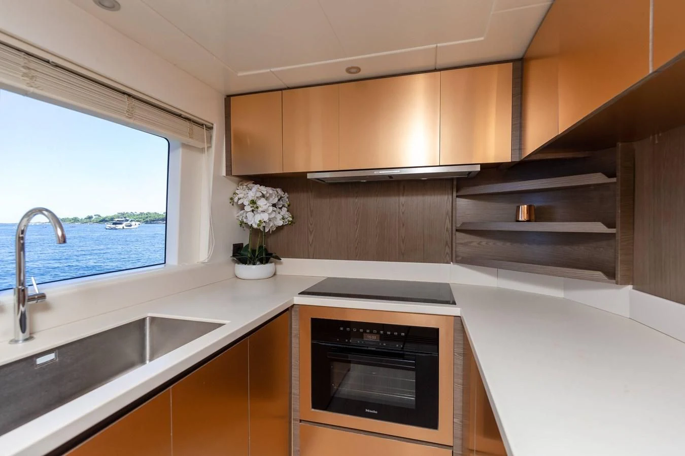 a kitchen with a stove and a sink aboard T9 Yacht for Sale